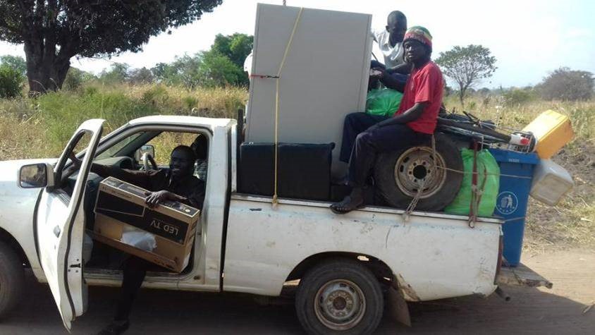 Clinic staff and community members evacuating equipment before the militia arrived